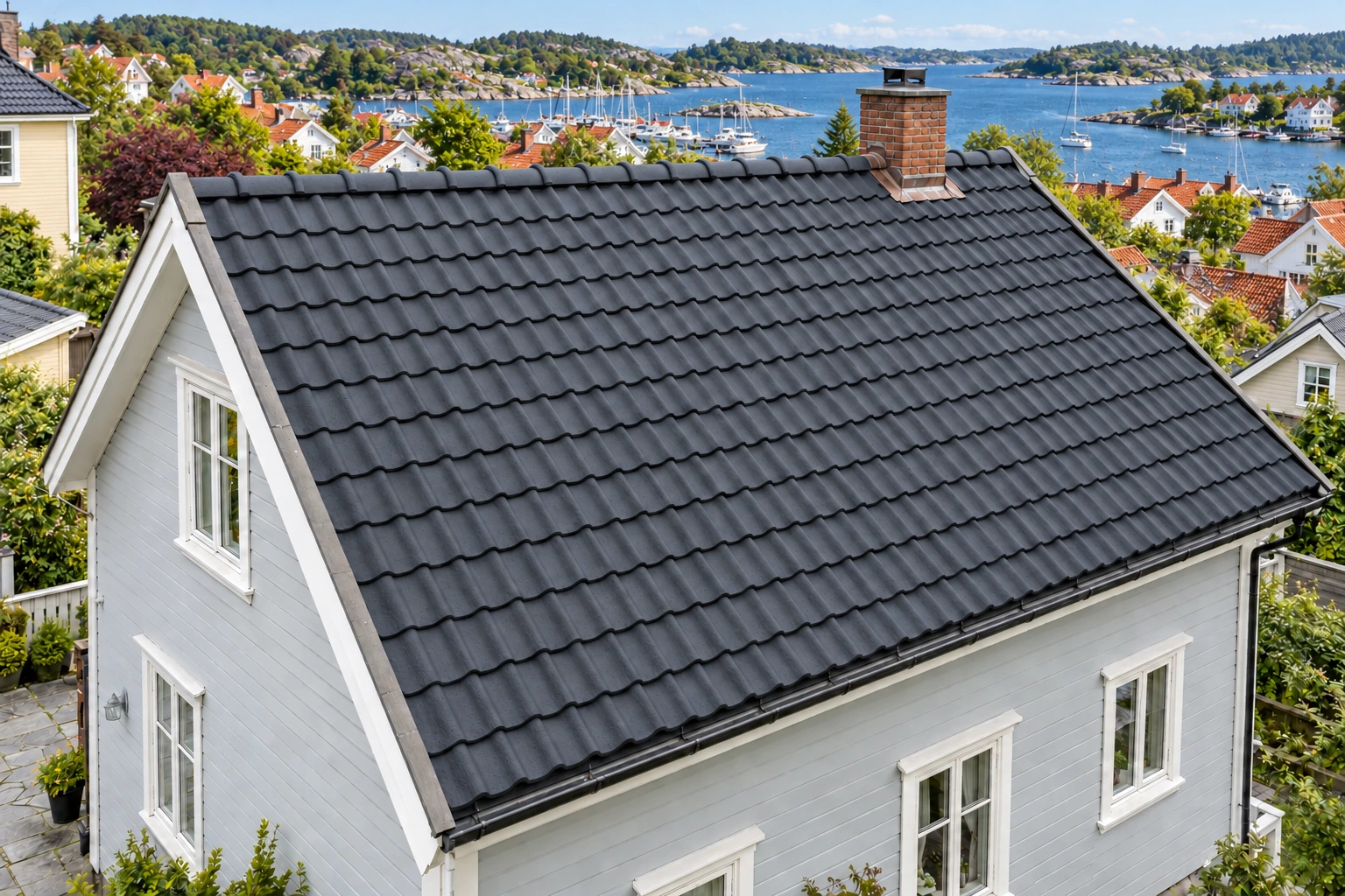 Eksisterende betongstein med en ny mørk overflatebehandling.